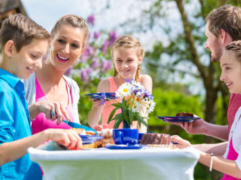 Family having coffee and cake in garden 479043644 1262x834